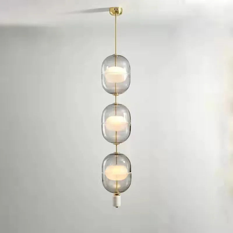 DecorBites™ مصباح معلق زجاجي شفاف رمادي وعنبري بلمسة نهائية معدنية من الرخام الذهبي