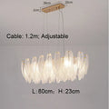 DecorBites™ ثريا ريش ذهبية بإضاءة LED معلقة لديكور المنزل