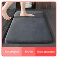 Dark gray plush coral velvet floor mat with absorbent coral velvet surface and non-slip backing for bathroom use