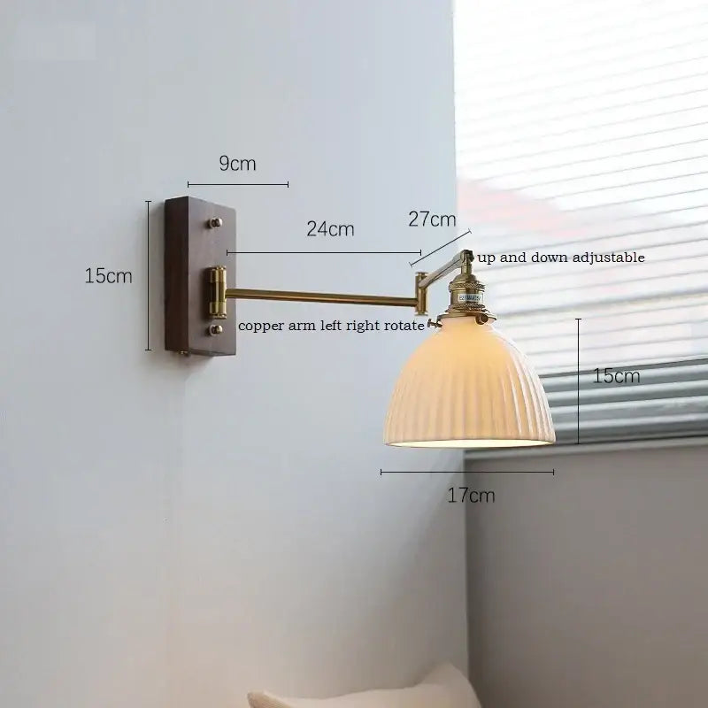 Adjustable brass wall sconce with ribbed glass shade bedroom light