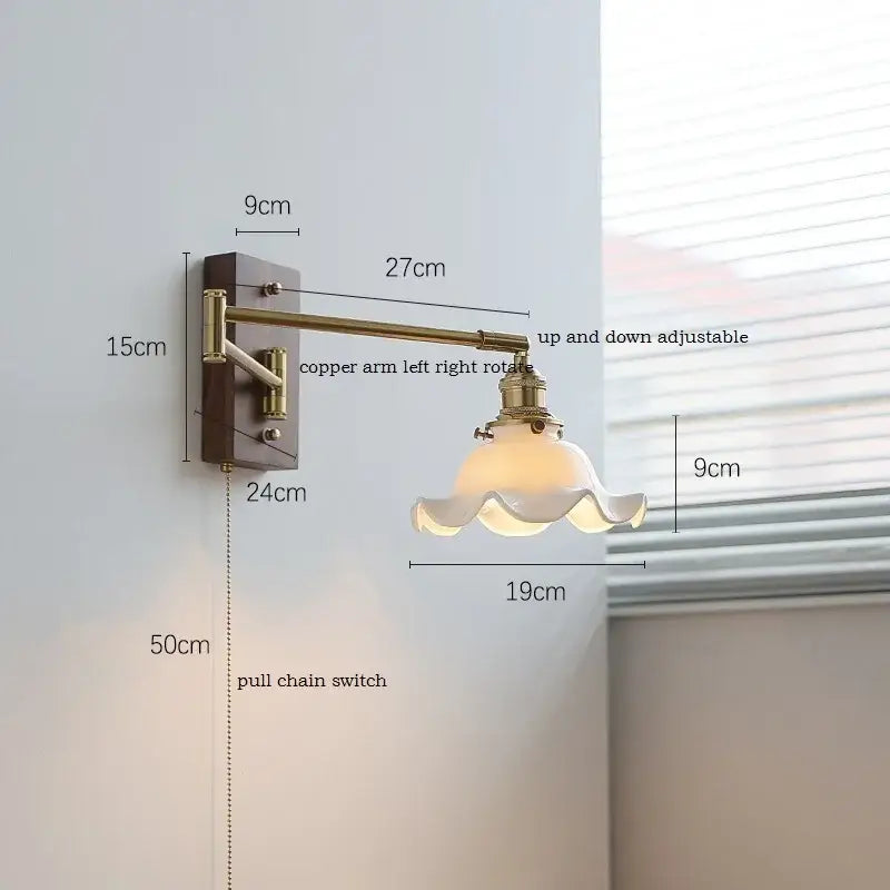 Adjustable brass wall sconce with ribbed glass shade bedroom light