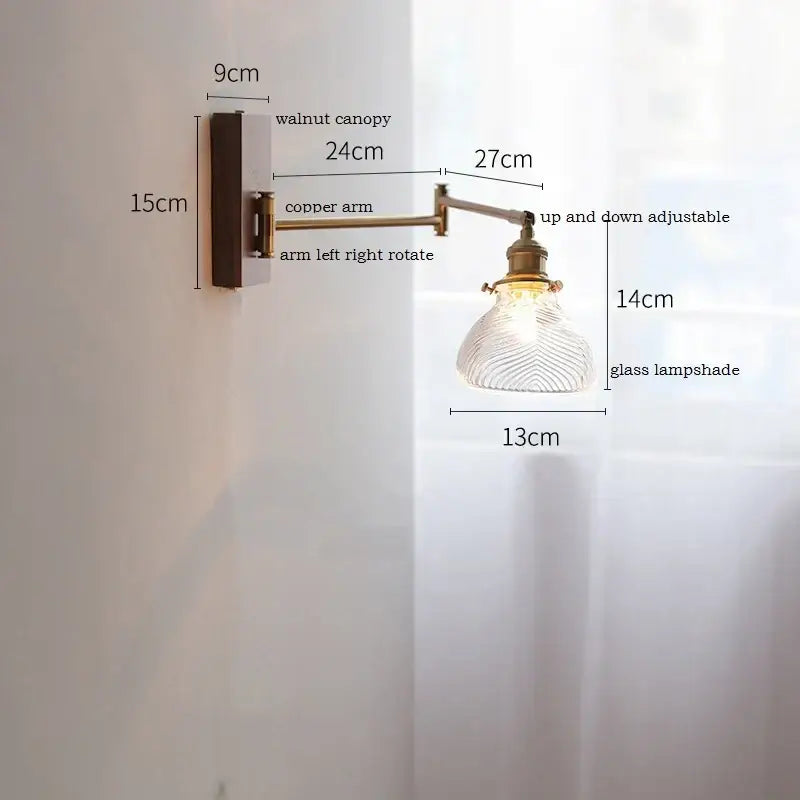 Adjustable brass wall sconce with ribbed glass shade bedroom light