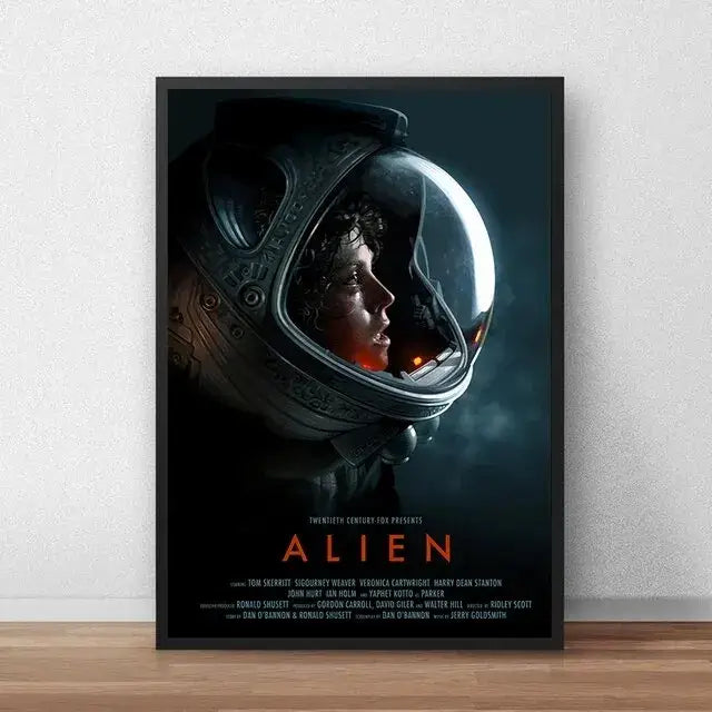 Black-framed canvas painting of alien movie poster featuring a metallic silver astronaut helmet with glowing orange light