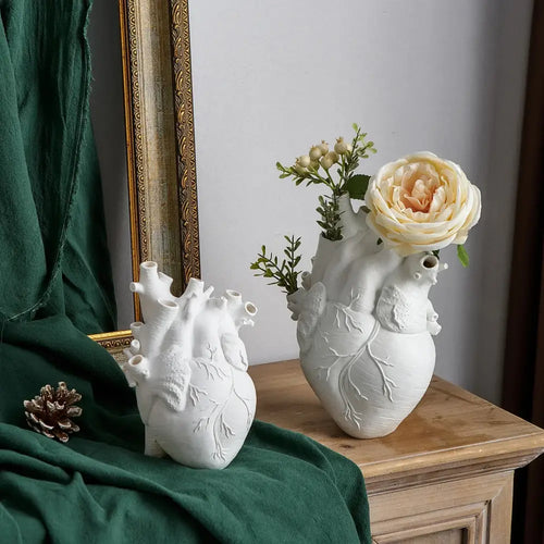 White ceramic anatomy heart vase with detailed features and decorative branches by DecorBites™ for unique gifts