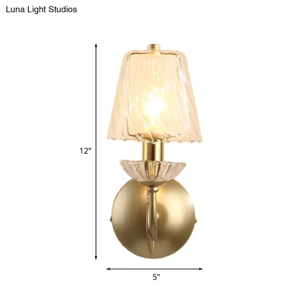 Antique brass conical sconce light with clear twisted glass bedroom
