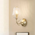 Antique brass conical sconce light with clear twisted glass bedroom
