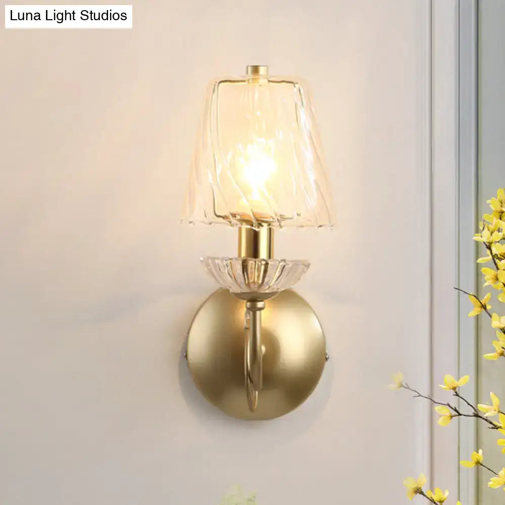 Antique brass conical sconce light with clear twisted glass bedroom