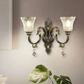 Antique brass floral wall sconce with metal base for bedroom