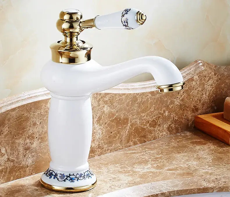 DecorBites antique bronze single handle bathroom faucet with white ceramic, gold accents, and blue floral real shot details