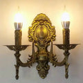 Antique gold retro european wall light with ornate gold-finished two-bulb candle sconce for bedroom use