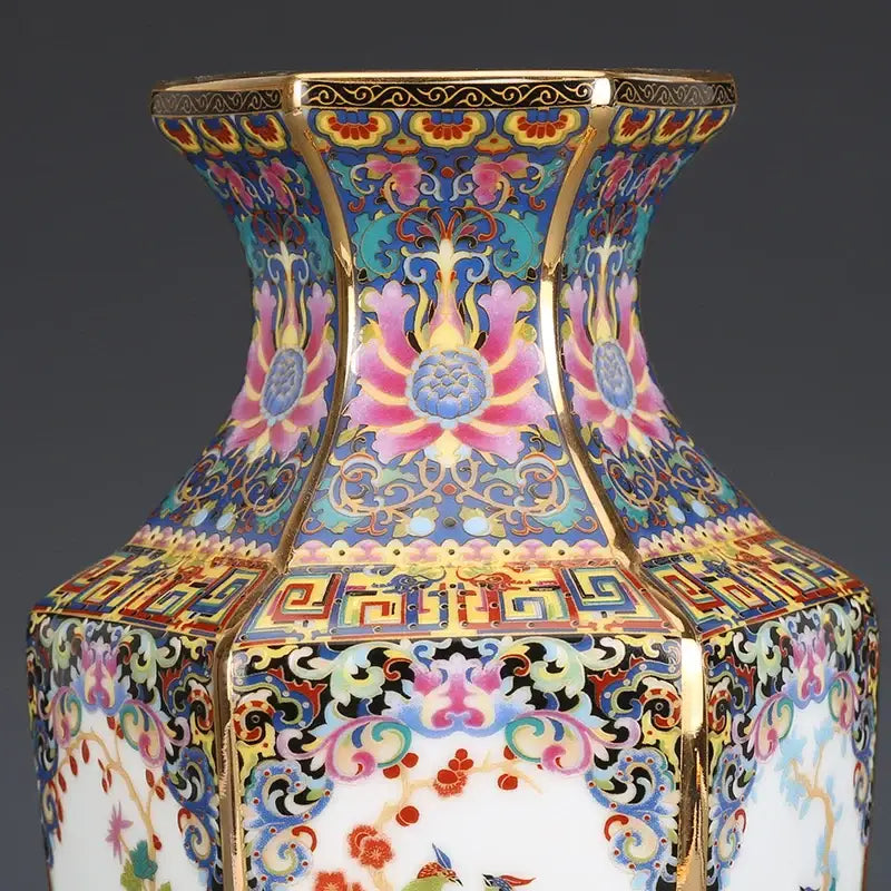 A hexagonal porcelain vase with colorful lotus enamel paintings and gold trim from an antique porcelain vase collection