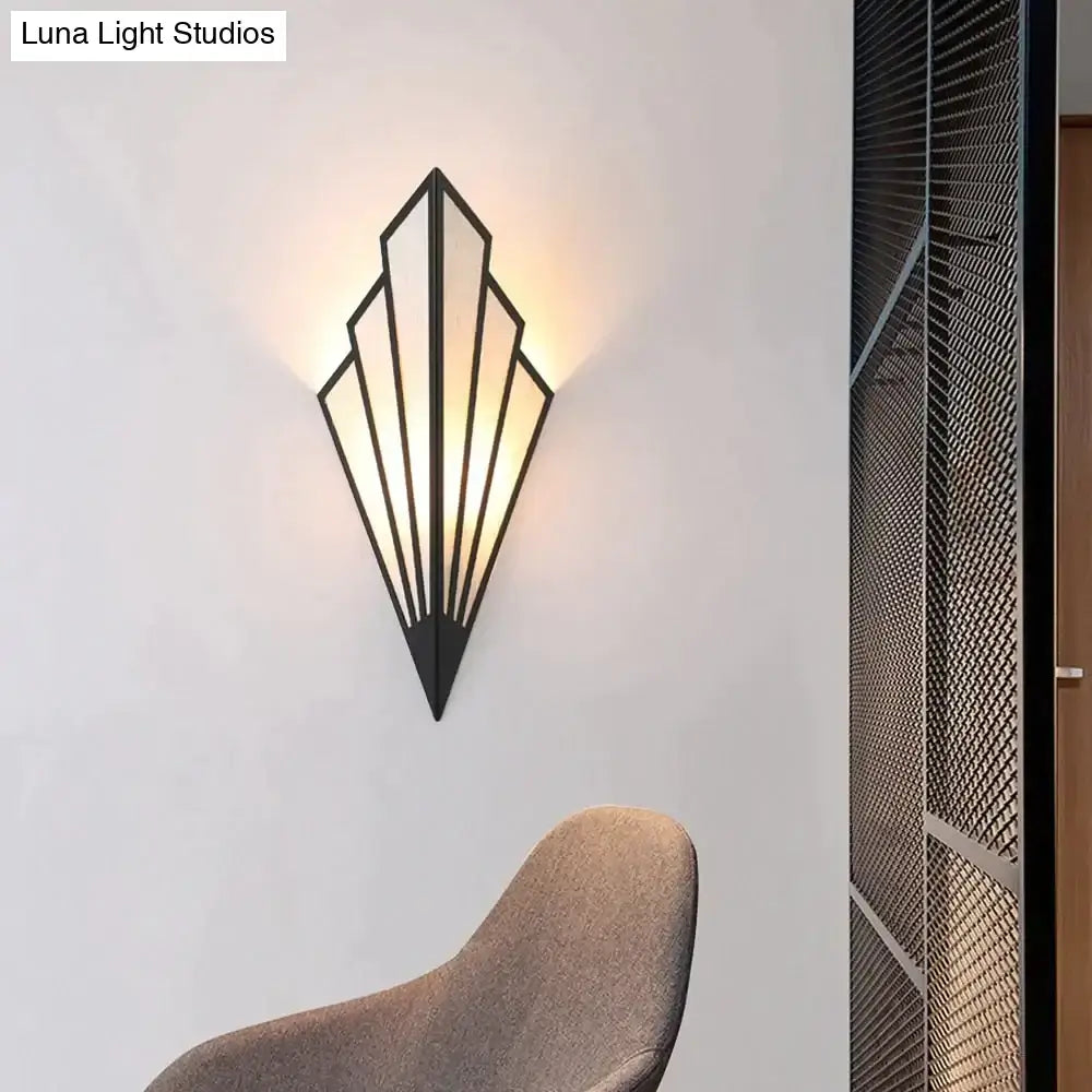Black metal art deco diamond shape modern wall light with geometric fan design and warm ambient lighting for bedroom