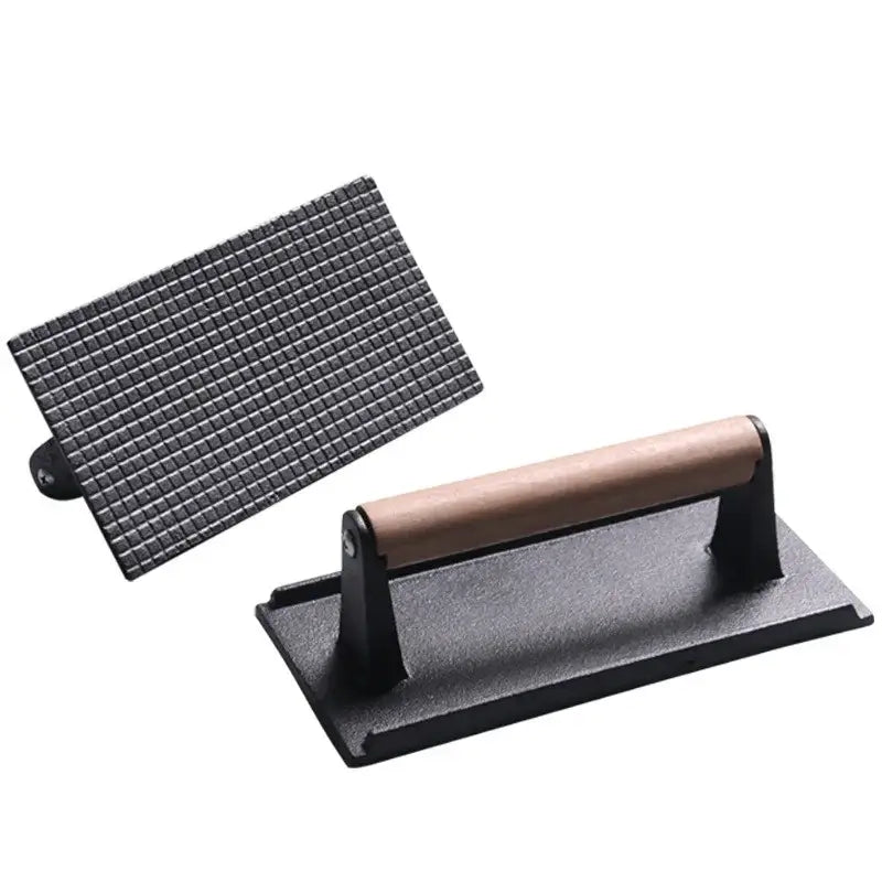 Black and light brown cast iron burger press kitchen meat tool