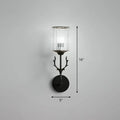 Black metal antler-inspired wall sconce with clear cylindrical glass shade compatible with e26 e27 bulbs for bedroom use