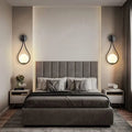 Gray upholstered bed shown alongside decorbites™ black battery operated wall sconces with remote and usb type-c charging