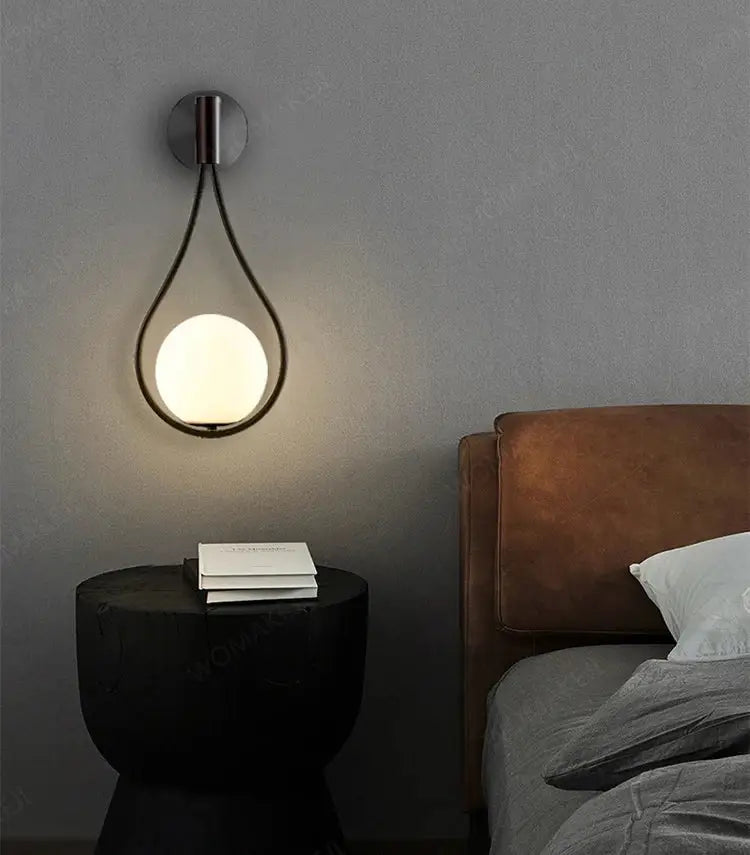 Teardrop-shaped black battery operated wall sconces with illuminated globe and usb type-c remote by decorbites
