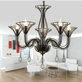 Black wrought iron chandelier with teardrop pendants for dining room