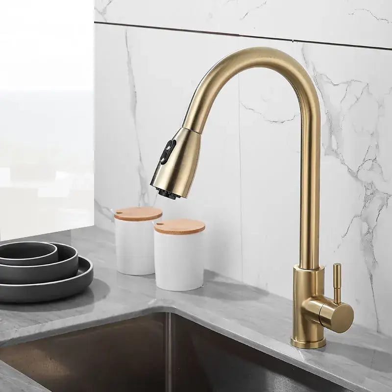 Brushed gold kitchen faucet with pull down spray head