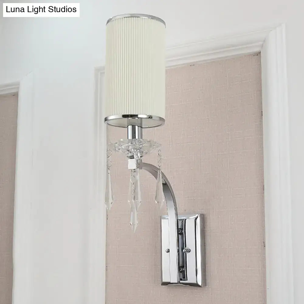 Chrome wall mounted sconce with crystal ribbed shade for living room