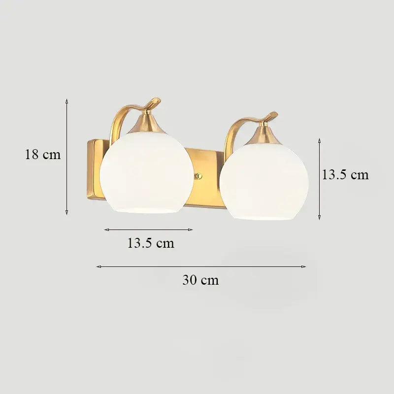 Classic brass glass wall sconce with frosted shade for bedroom