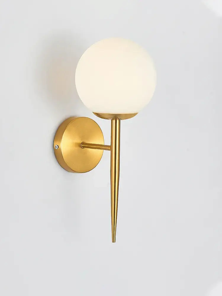 Classic brass glass wall sconce with frosted shade for bedroom