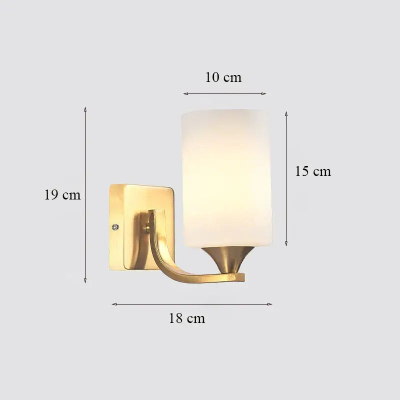 Classic brass glass wall sconce with frosted shade for bedroom