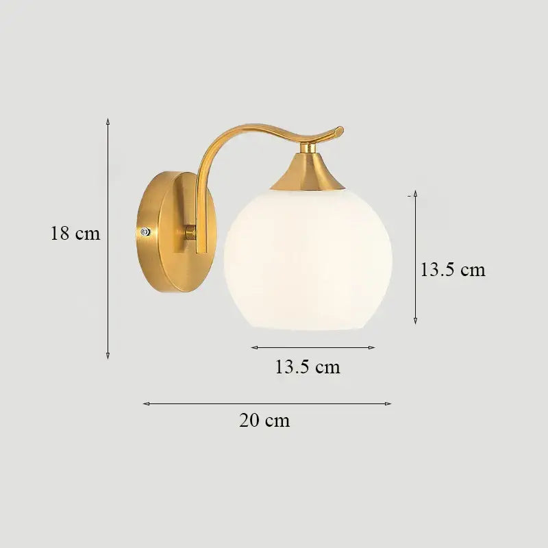 Classic brass glass wall sconce with frosted shade for bedroom