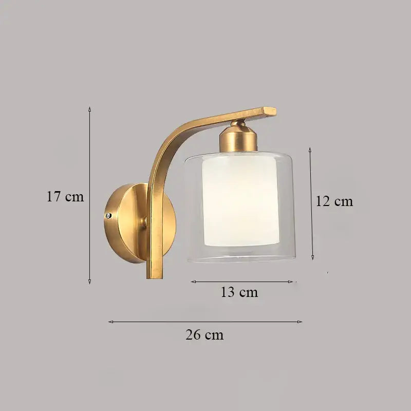 Classic brass glass wall sconce with frosted shade for bedroom