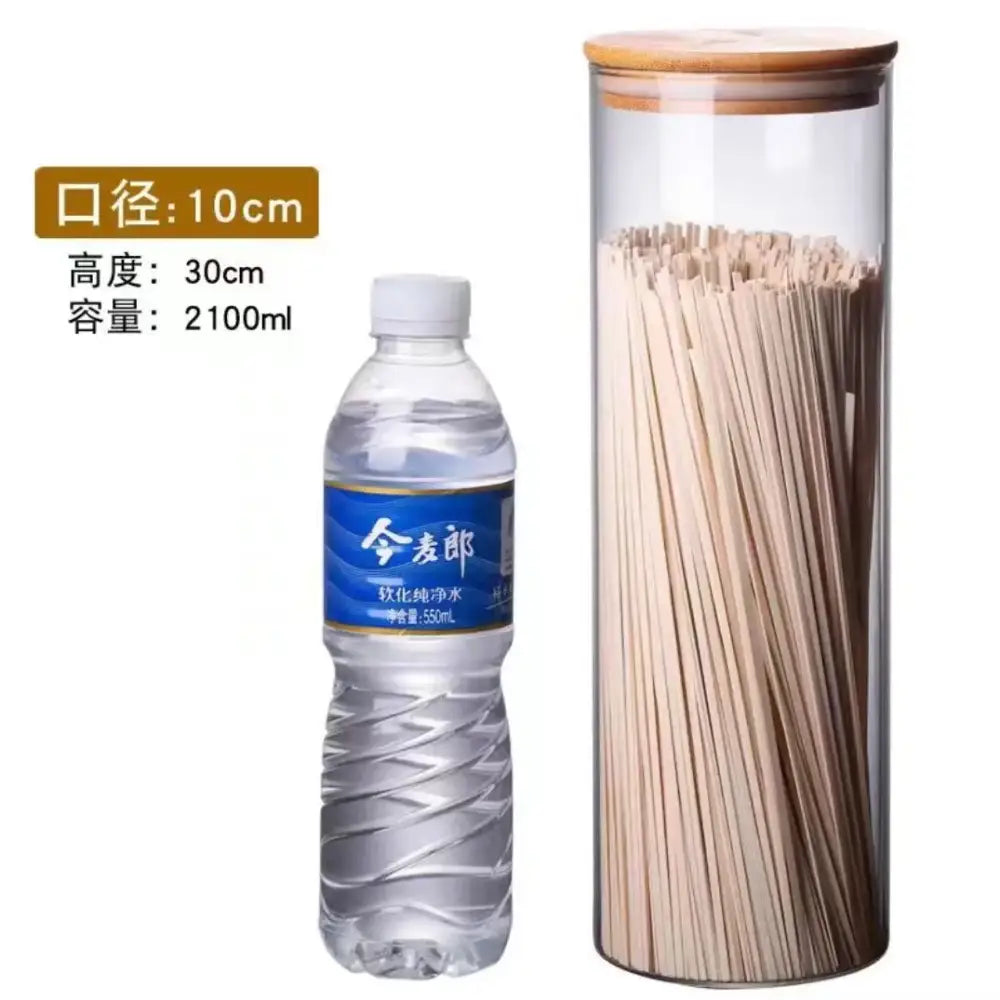 Clear glass storage jars with bamboo lids for kitchen organization
