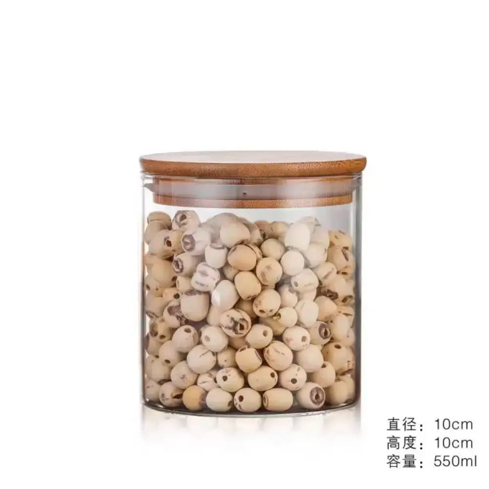 Clear glass storage jars with bamboo lids for kitchen organization