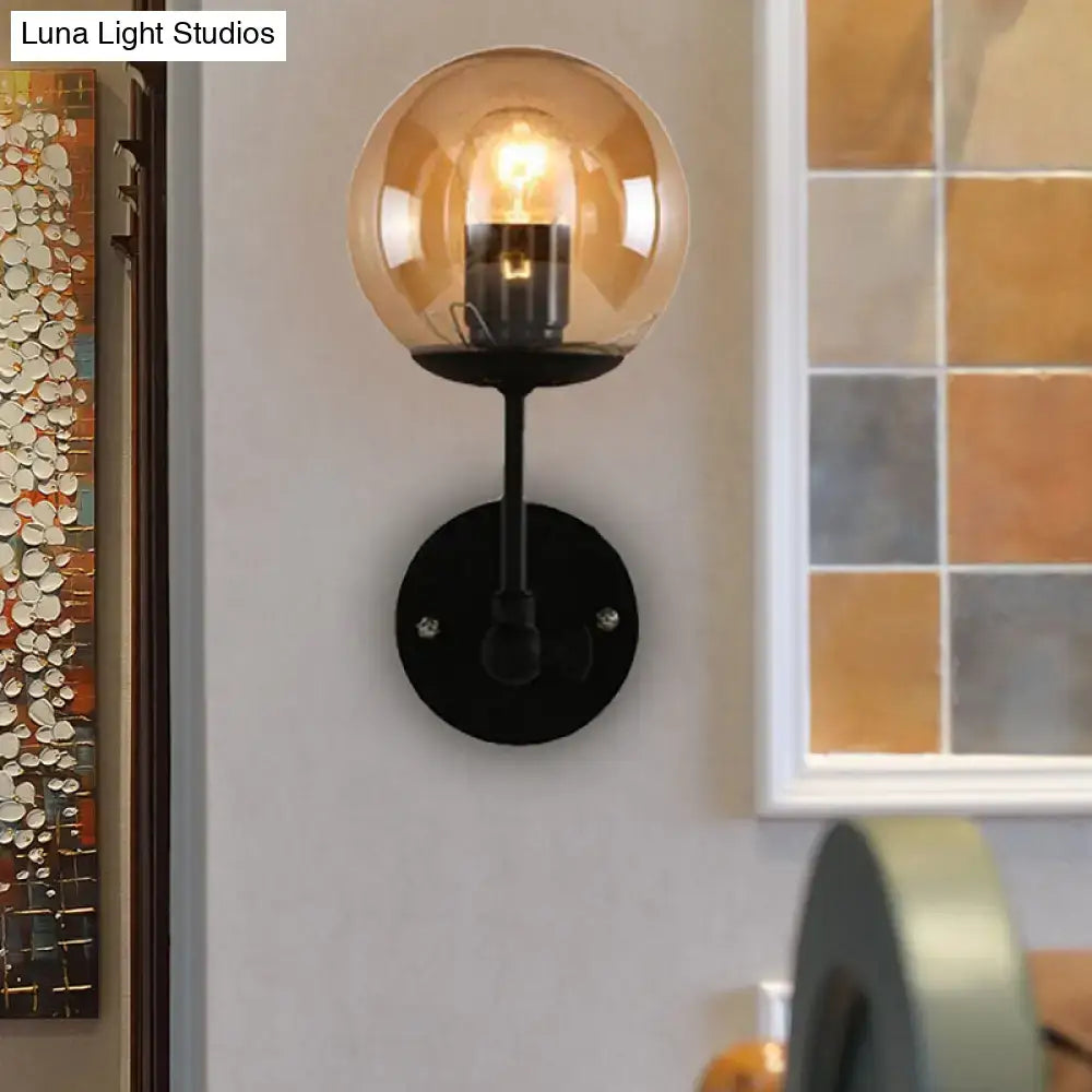 Contemporary black and amber globe glass wall light bedroom