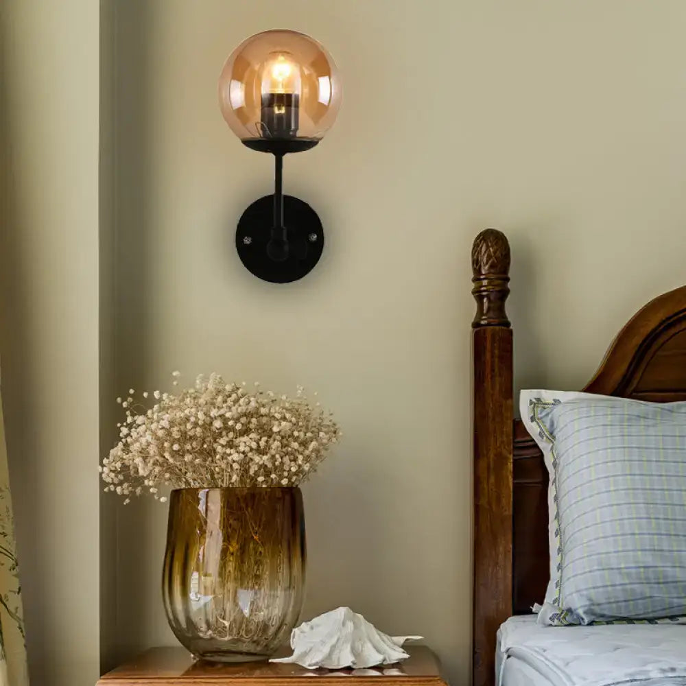 Contemporary black and amber globe glass wall light bedroom