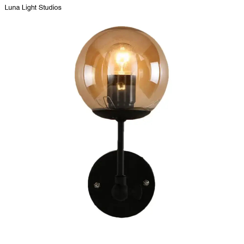 Contemporary black and amber globe glass wall light bedroom