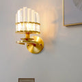 Contemporary brass wall lamp with gold-toned circular plate and clear crystal vertical prisms for e12 e14 bulbs