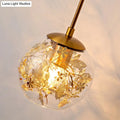 Contemporary brass clear glass wall lamp with foil flower decor bedroom