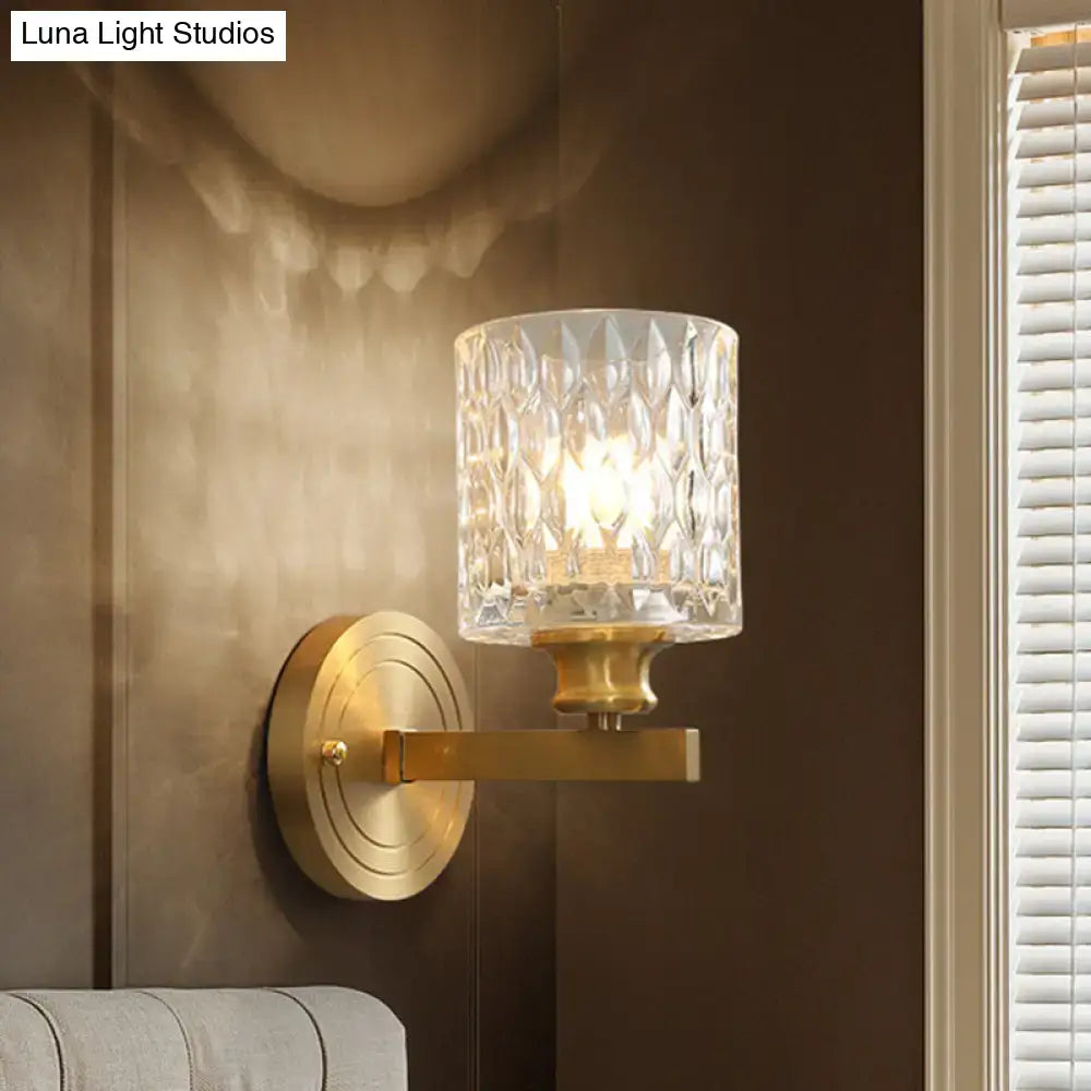 Contemporary brass cylindrical wall light bedroom faceted glass sconce