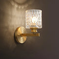 Contemporary brass cylindrical wall light bedroom faceted glass sconce