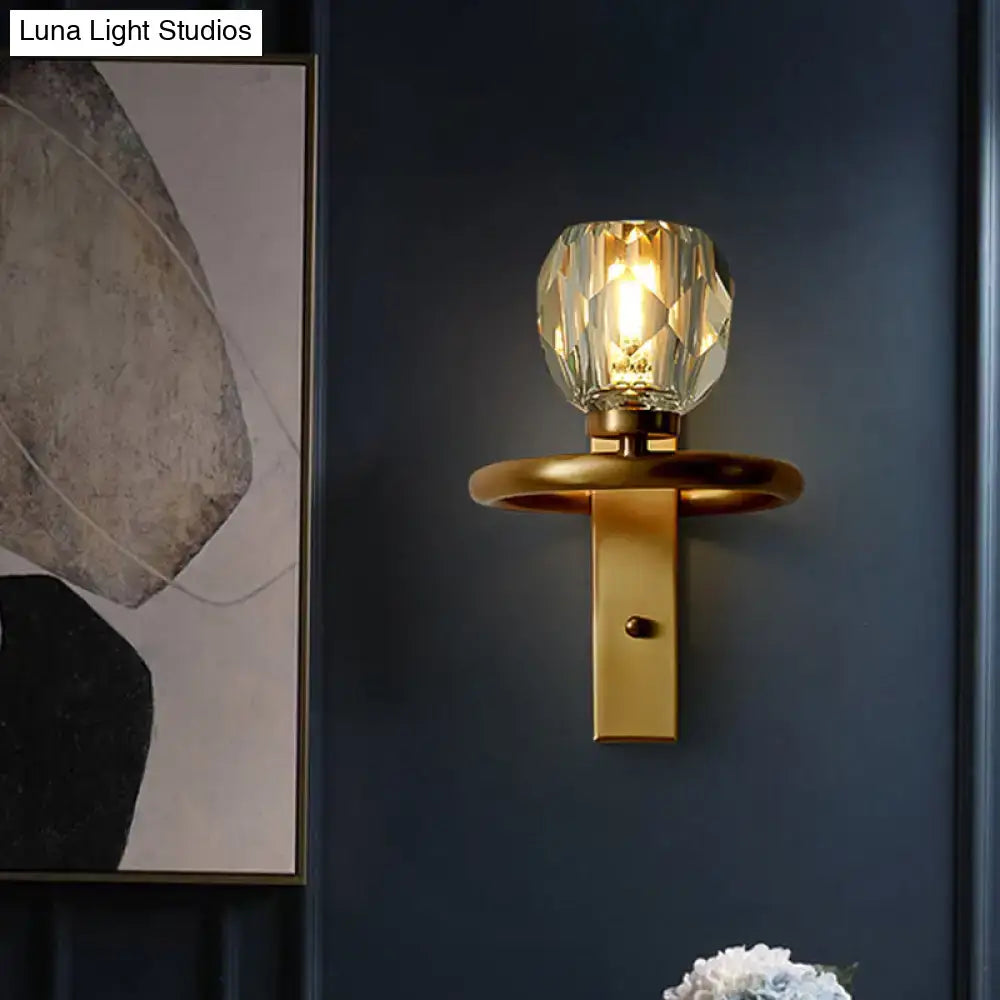 Contemporary brass wall sconce with global crystal shade dining room
