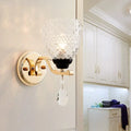 Contemporary gold crystal drop wall sconce with faceted glass shade and dangling teardrop crystal pendant inch fixture