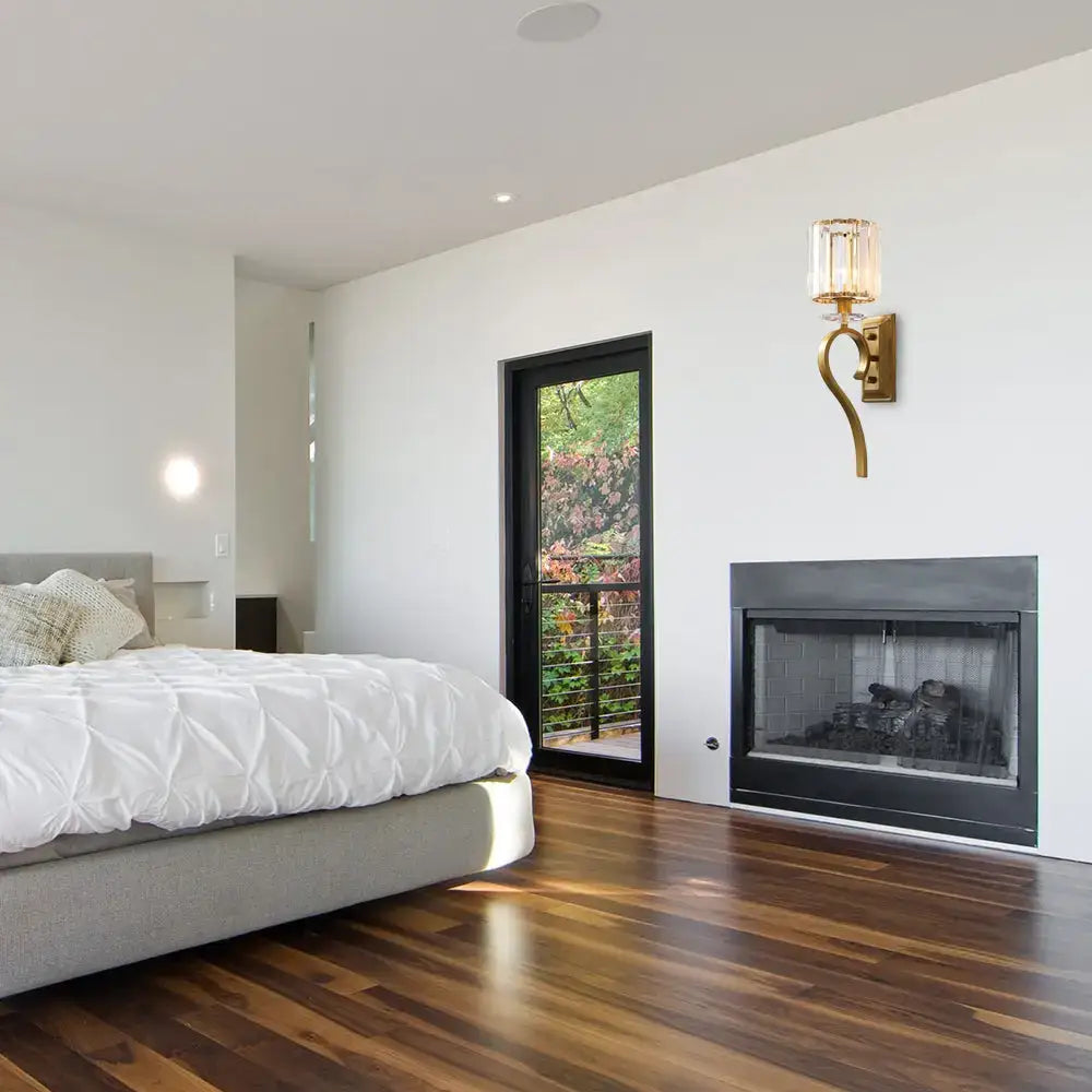 Contemporary gold cylinder wall light with crystal accents for bedroom