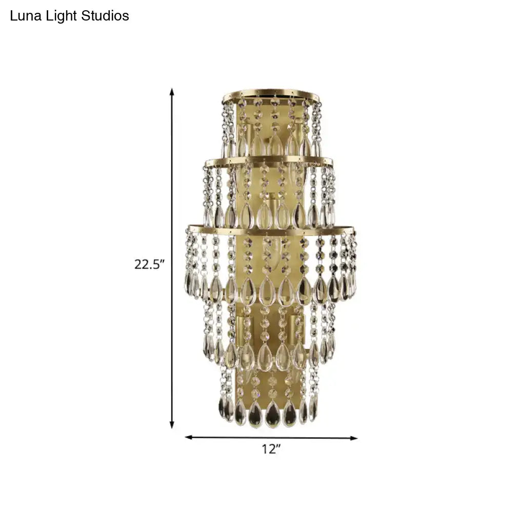 Contemporary gold layered bedside wall lamp with teardrop crystals