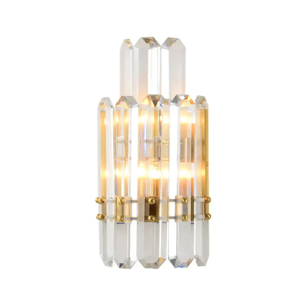 Contemporary gold wall sconce with clear crystal prisms for dining room
