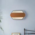 Contemporary grey and brown wall lamp with sleek frame and leather accent strip featuring natural color temperature and direct wired electric