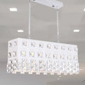 Contemporary ivory metal chandelier with white rectangular frame and clear crystal accents for dining room lighting