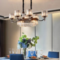 A contemporary prismatic crystal hanging pendant with dark bronze frame and multiple crystal glass shades for restaurants