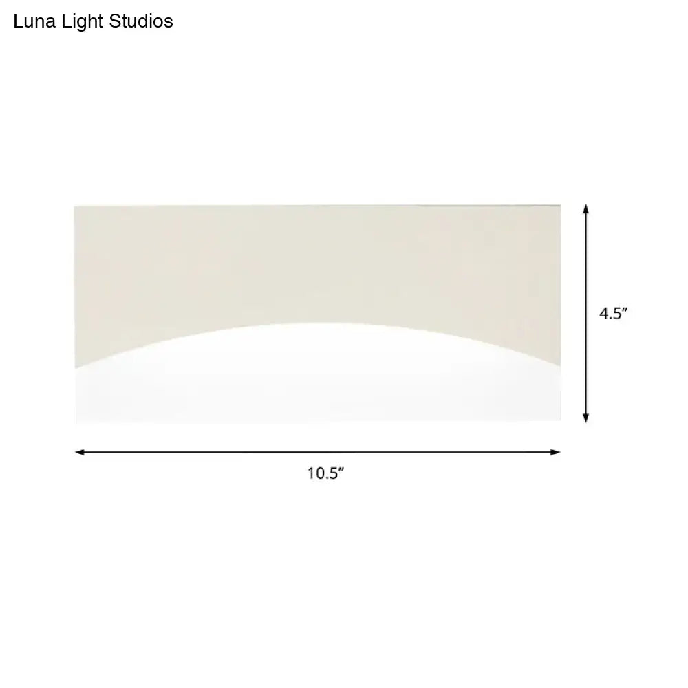 Contemporary white & gold bedroom sconce with warm color temperature