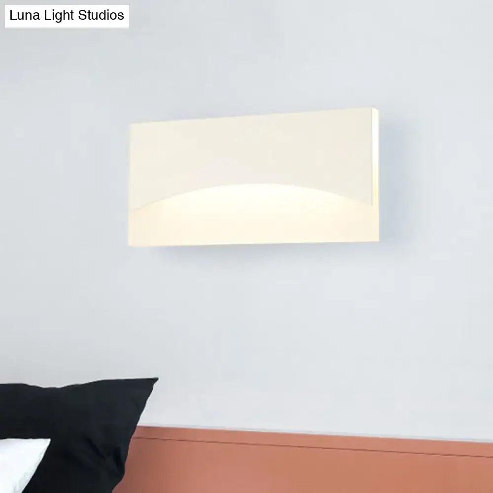 Contemporary white & gold bedroom sconce with warm color temperature