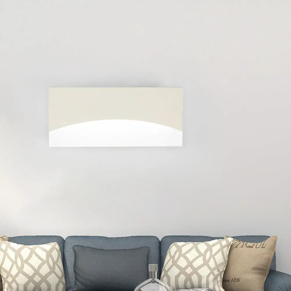 Contemporary white & gold bedroom sconce with warm color temperature