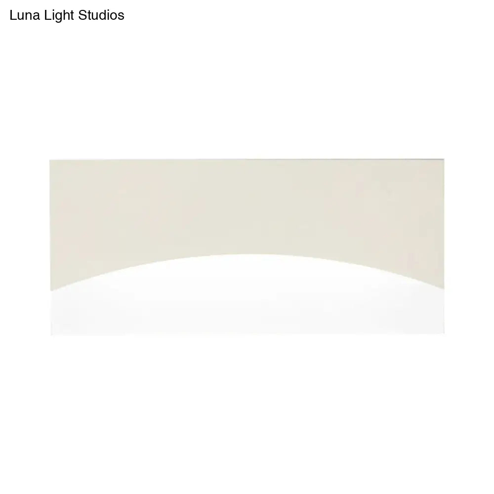Contemporary white & gold bedroom sconce with warm color temperature