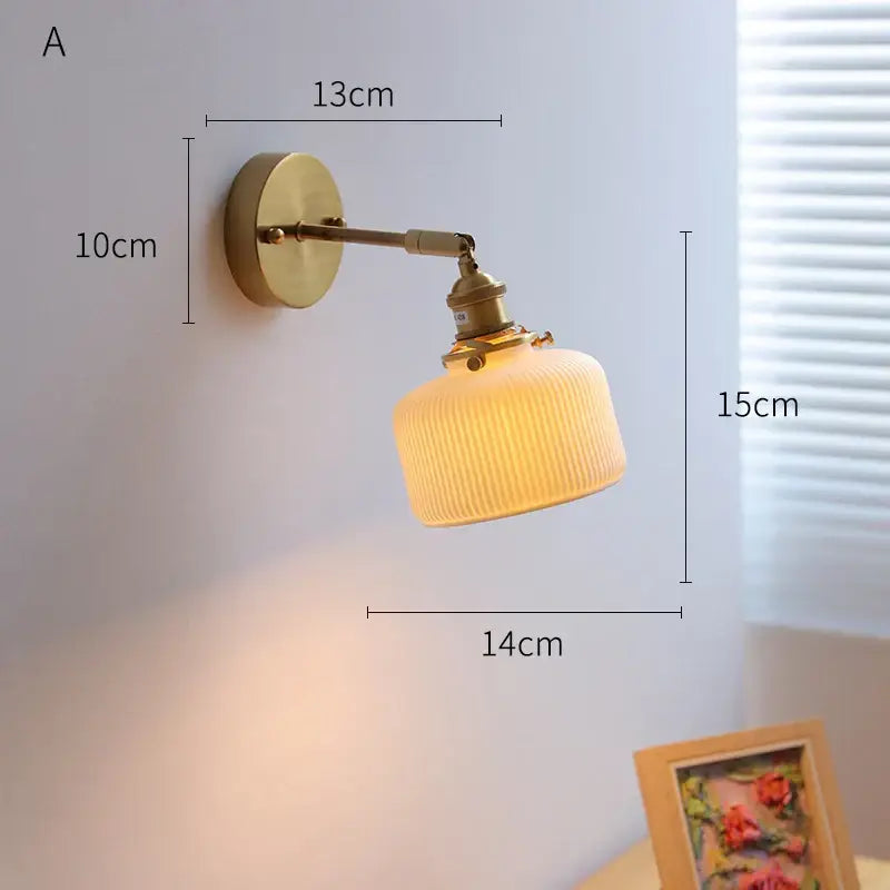 Cream ceramic led wall light with copper arm bedroom sconce